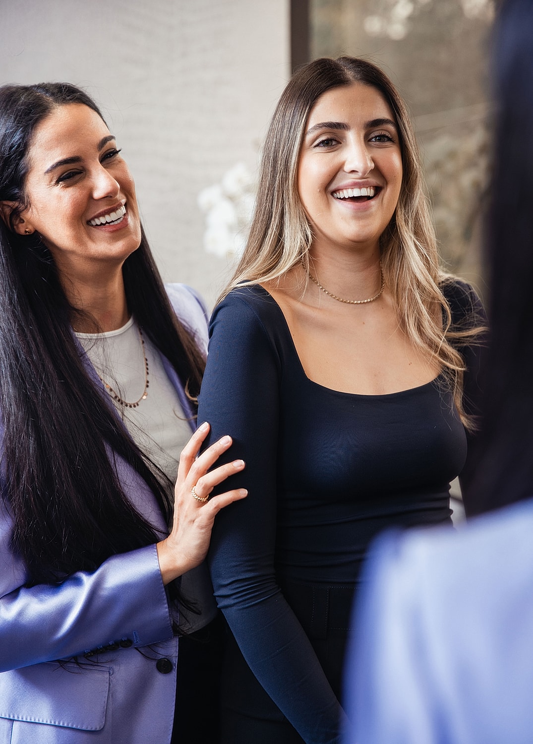 Woman in white dress, eyes closed in serenity.