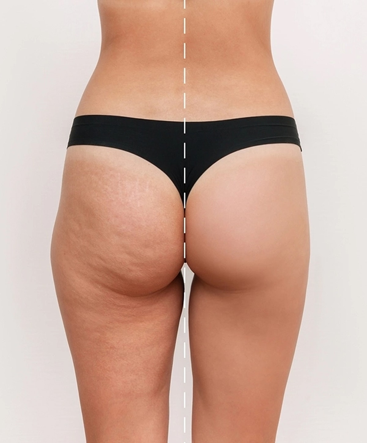 Woman walking up stairs in fitted jeans.