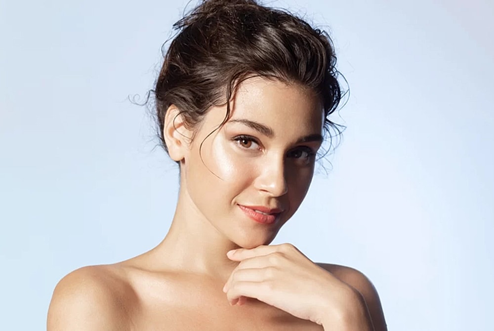 Young woman with natural beauty and soft smile.