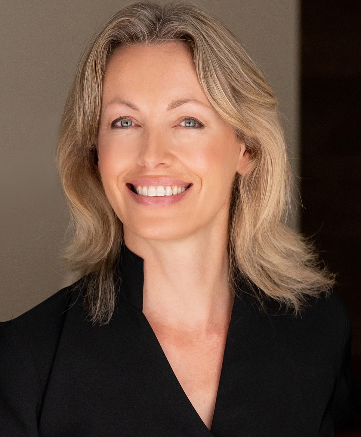 Woman walking up stairs in fitted jeans.