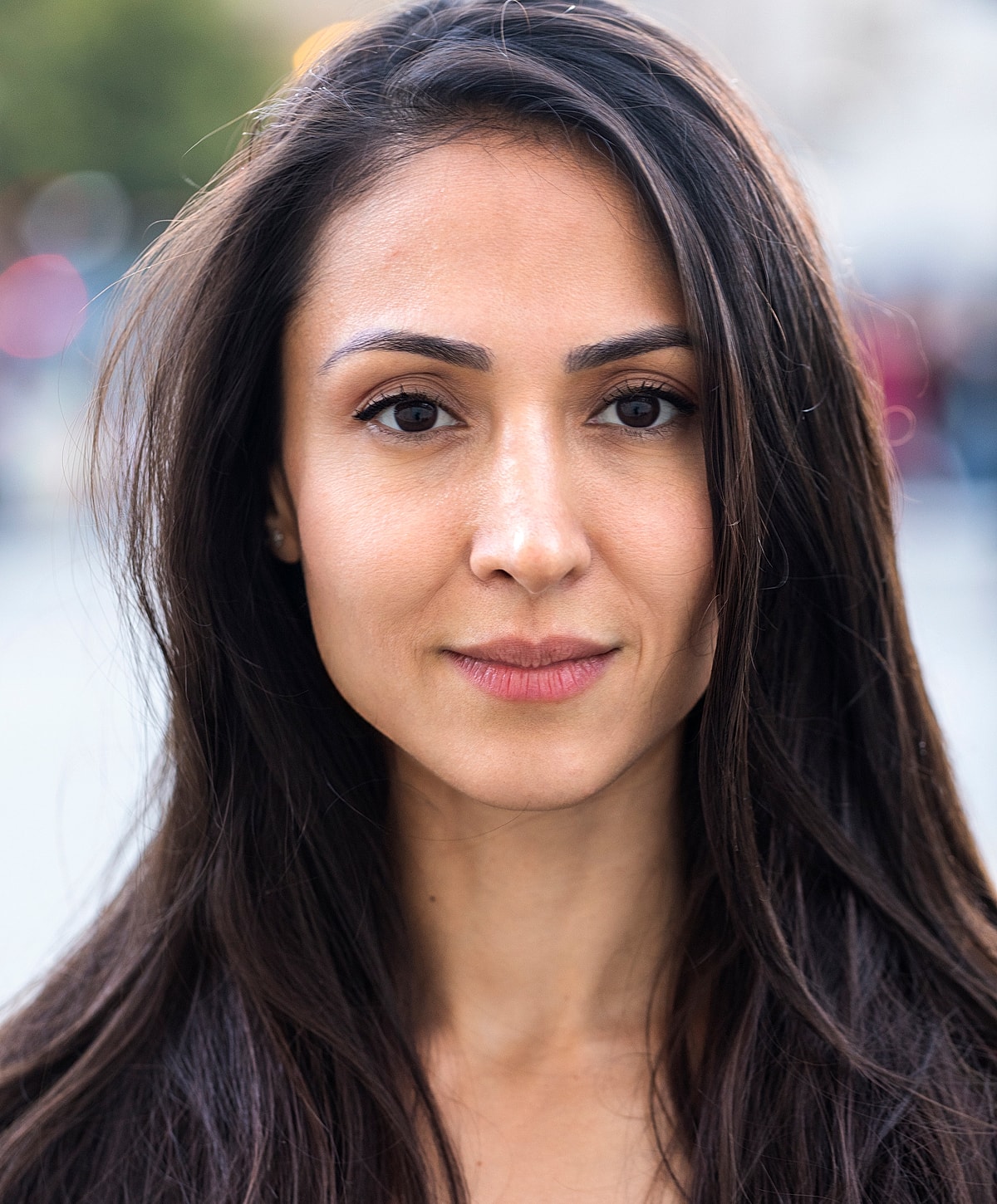 Woman walking up stairs in fitted jeans.